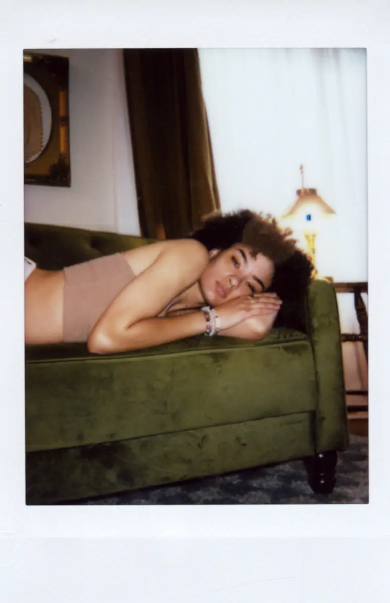 Portrait presented within a white instant-film border