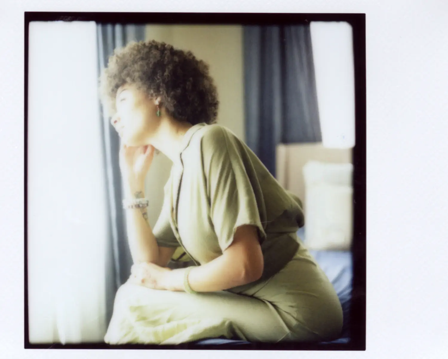 Horizontal portrait showing the room around the subject